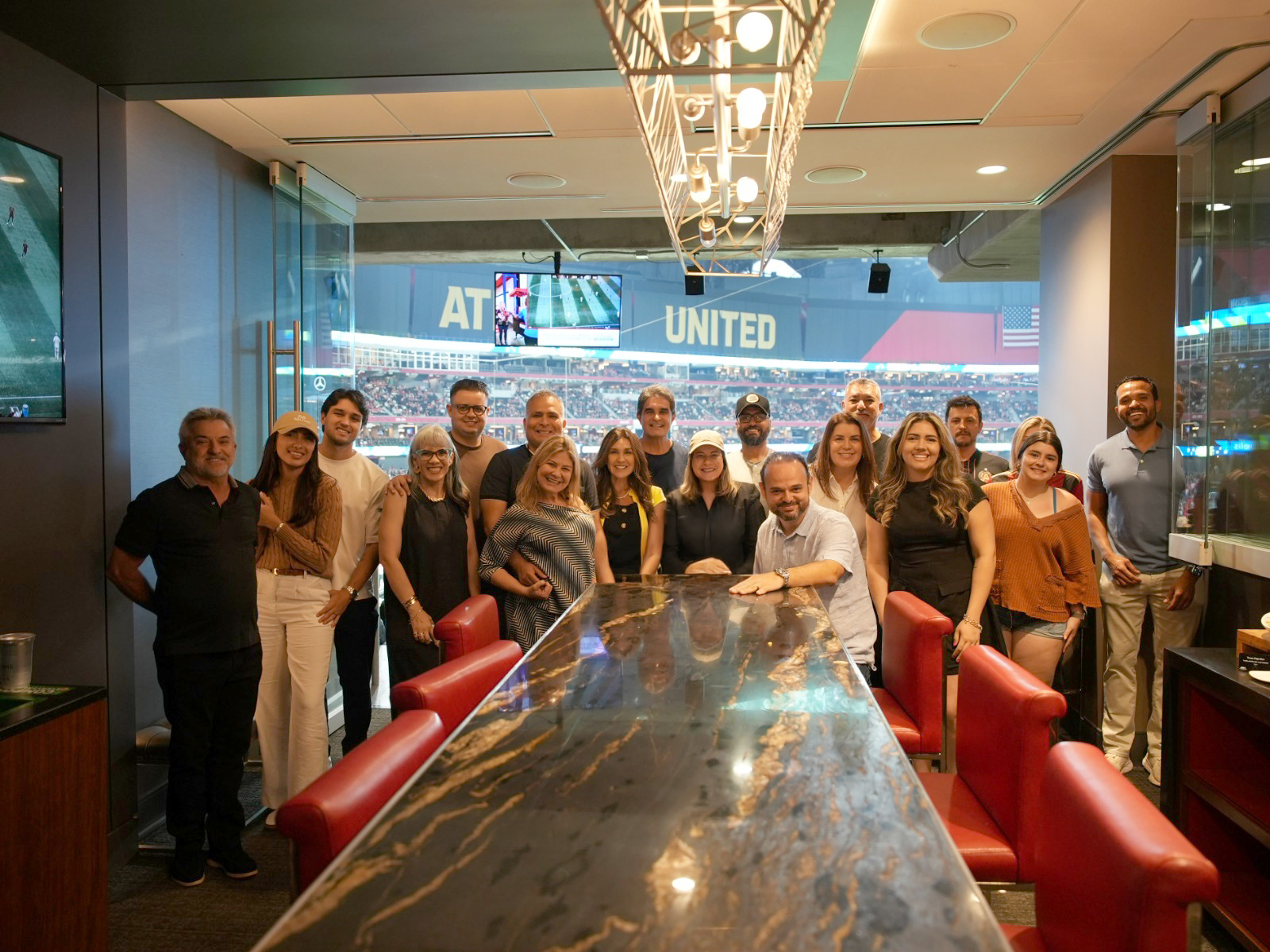 NWX clients gathered inside a premium stadium hospitality suite